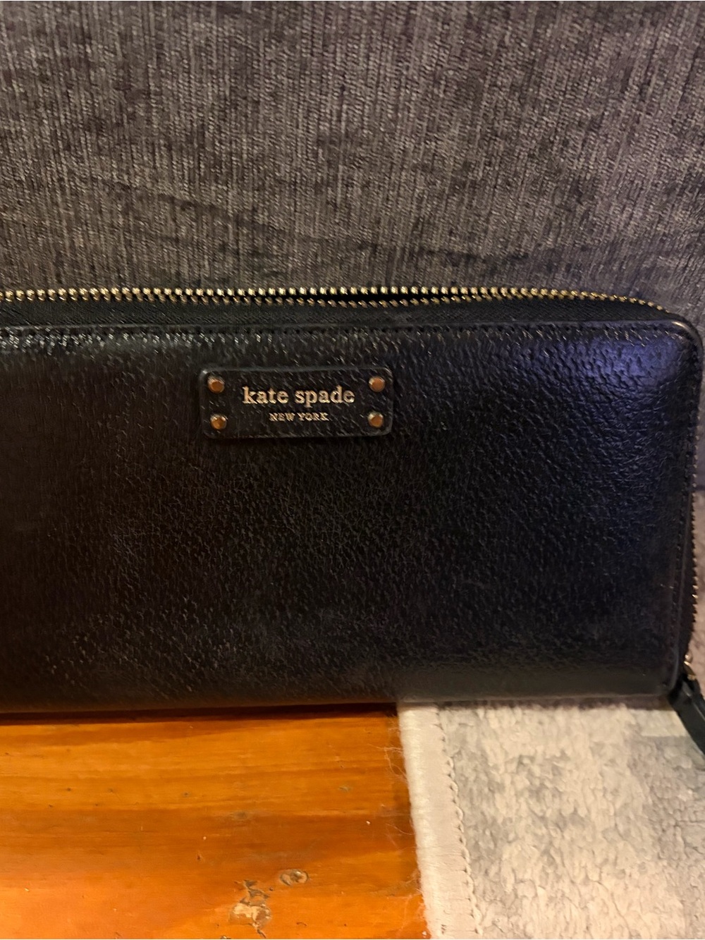 kate spade Black Pebbled Leather Zip-Around Wallet with Gold Hardware